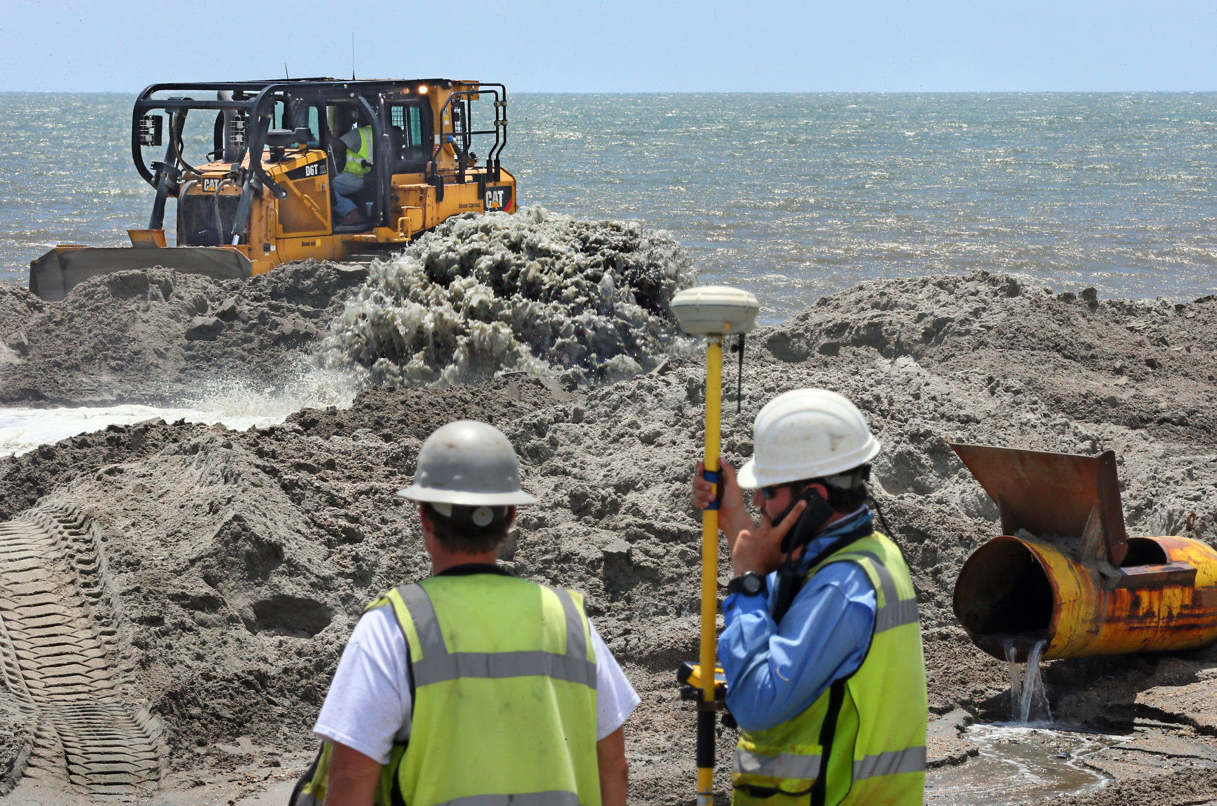 bulldozer surveyor pipe renourishment folly beach.jpg (copy)